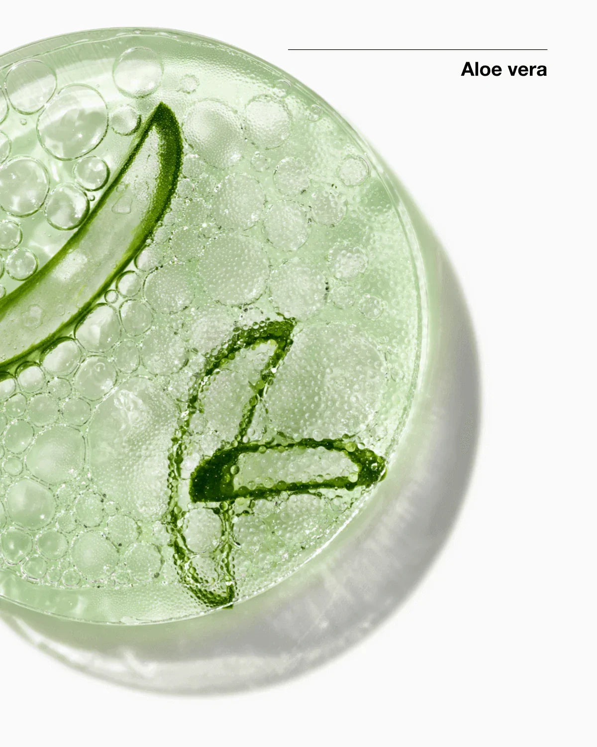 Close-up of aloe vera gel with bubbles on a white background, labeled 'Aloe vera'.