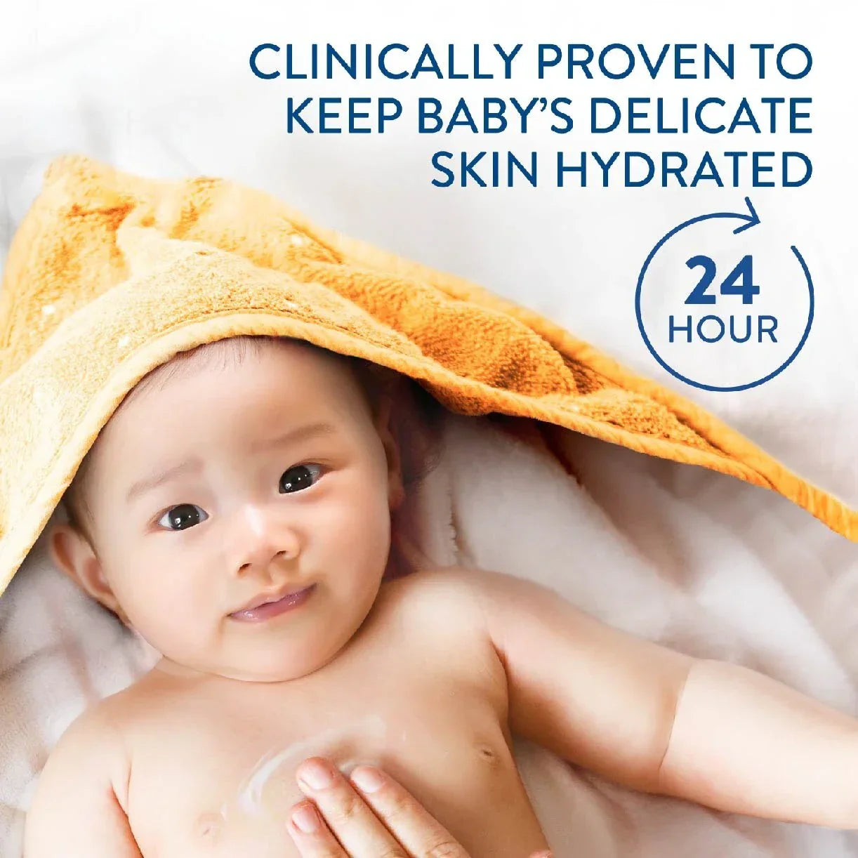 Baby wrapped in a yellow towel with text about skin hydration